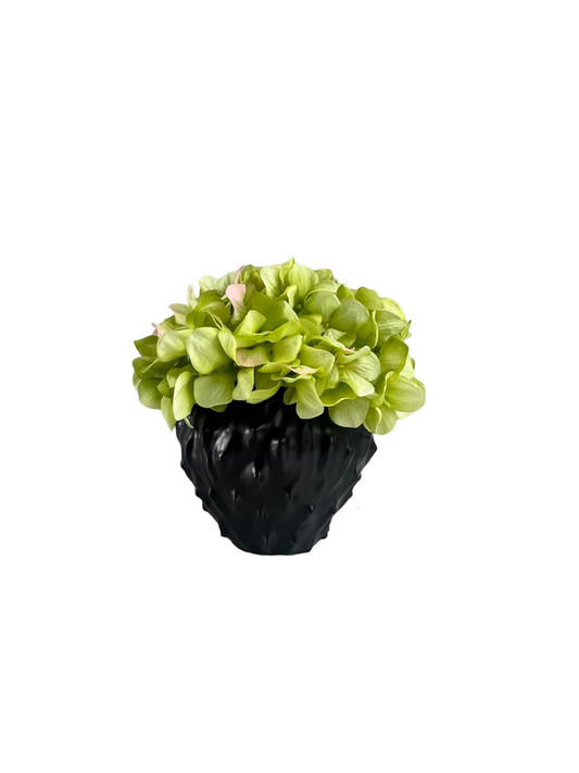 lime green artificial hydrangea set in a black contemporary style planter.