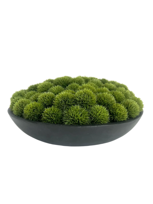 Lush green artificial dianthus set in a large black mango wood bowl.
