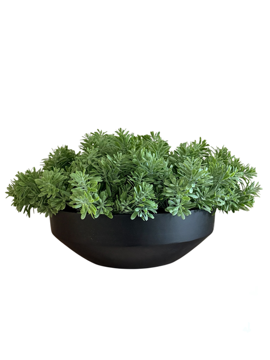 Lush green artificial crossestephium arranged in a black mango wood large bowl planter.
