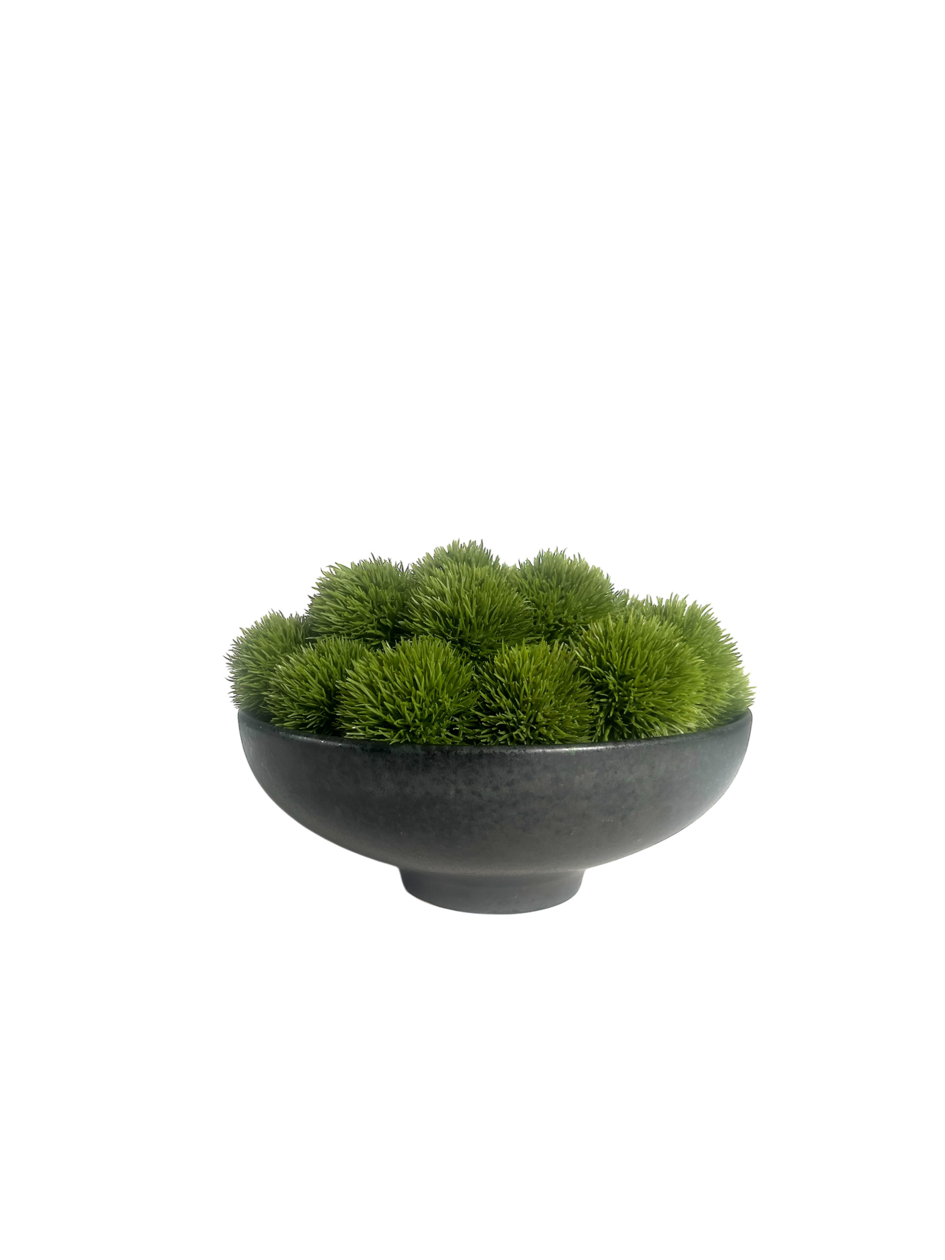 Lush green artificial dianthus set in a footed black ceramic bowl.