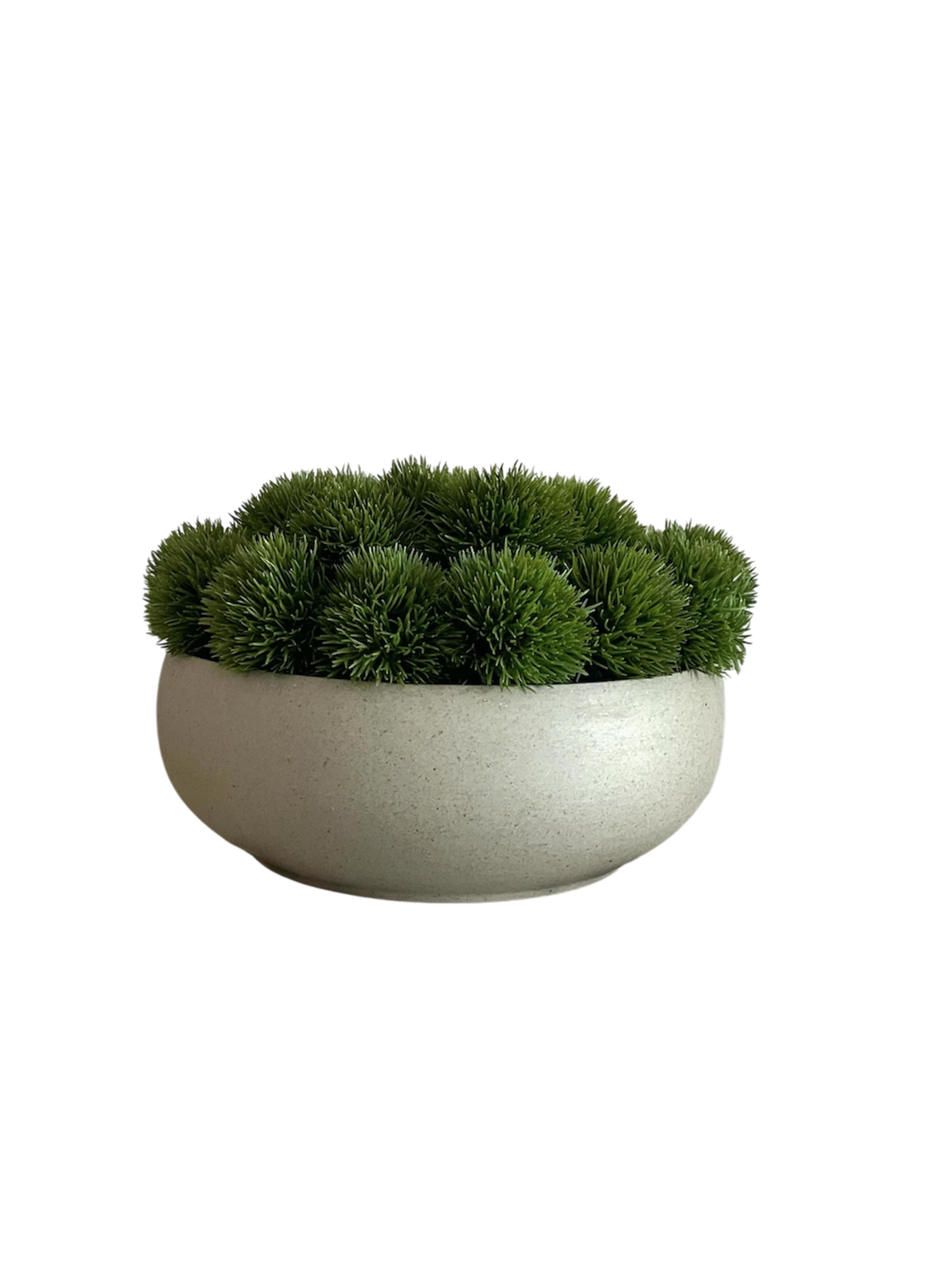 Artificial lush green dianthus nestled in a neutral colour ceramic bowl planter.