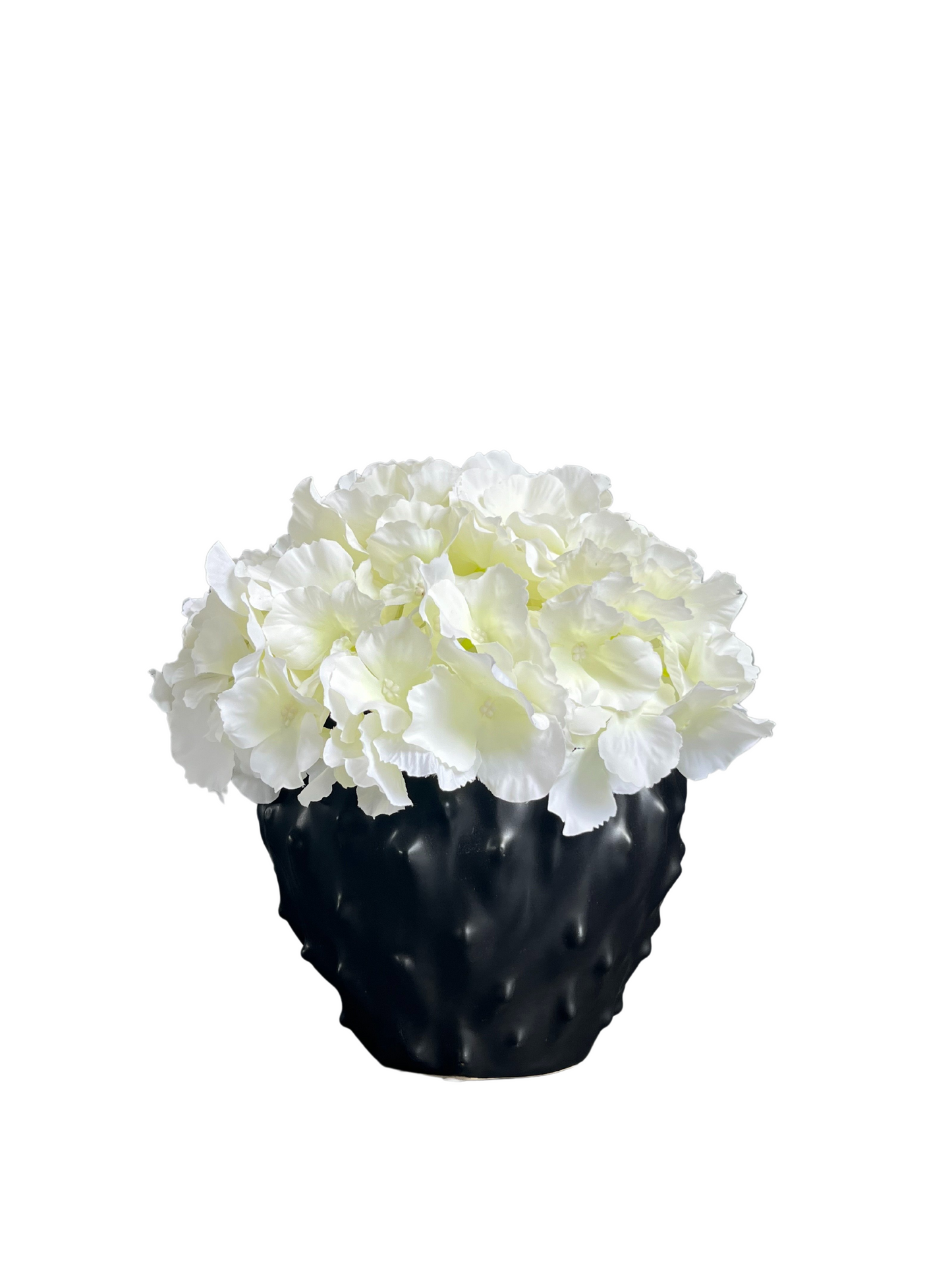 Cream artificial hydrangea set in a spiky black stoneware pot.